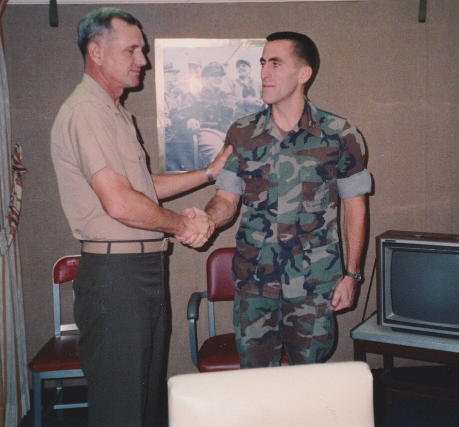 Matthew J. Baker Attorney shaking hands with a soldier